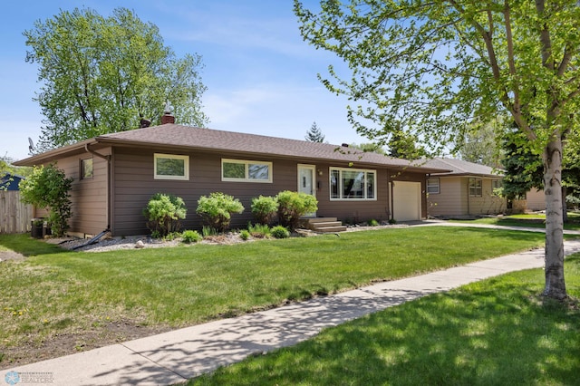 1214 8th St N, Moorhead, MN 56560 - ranch-style house with a garage, a chimney, a front lawn, and concrete driveway