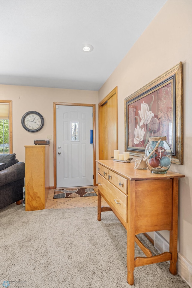 1214 8th St N, Moorhead, MN 56560 - tiled foyer with carpet and baseboards