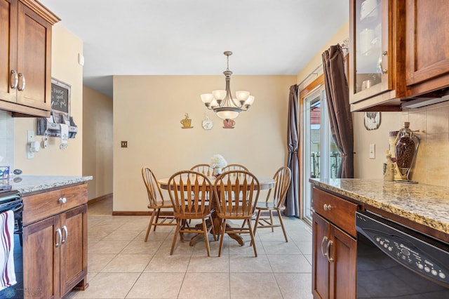1214 8th St N, Moorhead, MN 56560 - dining space with a chandelier, baseboards, and light tile patterned flooring