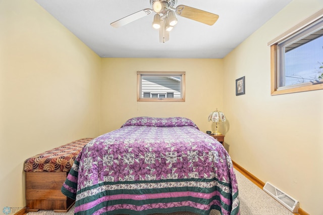 1214 8th St N, Moorhead, MN 56560 - bedroom with ceiling fan and baseboards