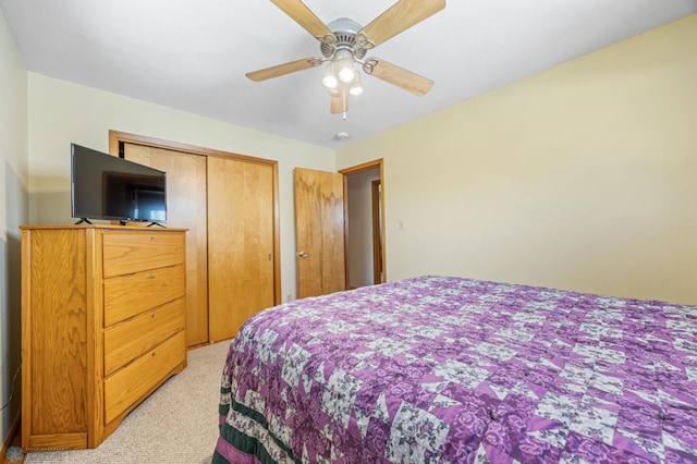 1214 8th St N, Moorhead, MN 56560 - bedroom featuring light carpet, a closet, and a ceiling fan