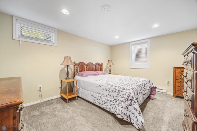 1214 8th St N, Moorhead, MN 56560 - carpeted bedroom with a baseboard heating unit, baseboards, and recessed lighting