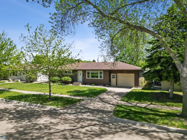 1214 8th St N, Moorhead, MN 56560 - single story home with an attached garage, driveway, and a front yard