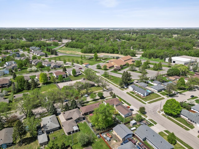 1214 8th St N, Moorhead, MN 56560 - aerial view of residential area featuring a forest