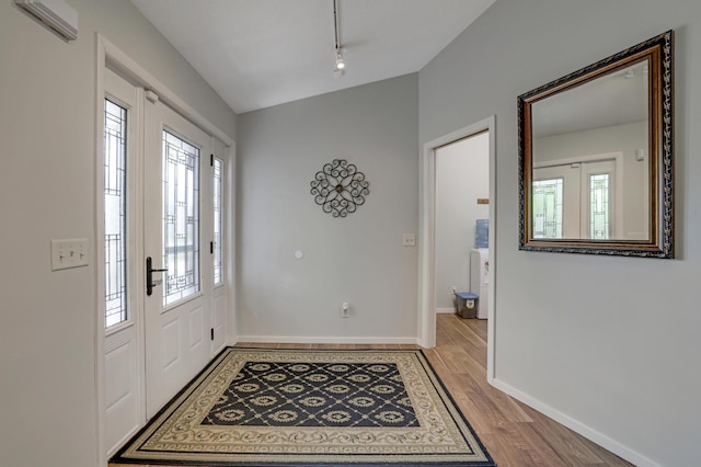 7256 Maciver Ave NE, Otsego, MN 55301 - foyer entrance with rail lighting, wood finished floors, and baseboards