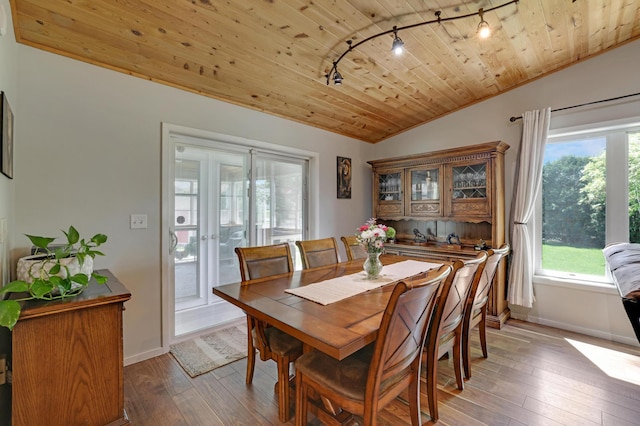 7256 Maciver Ave NE, Otsego, MN 55301 - dining room featuring track lighting, vaulted ceiling, wood ceiling, hardwood / wood-style floors, and baseboards