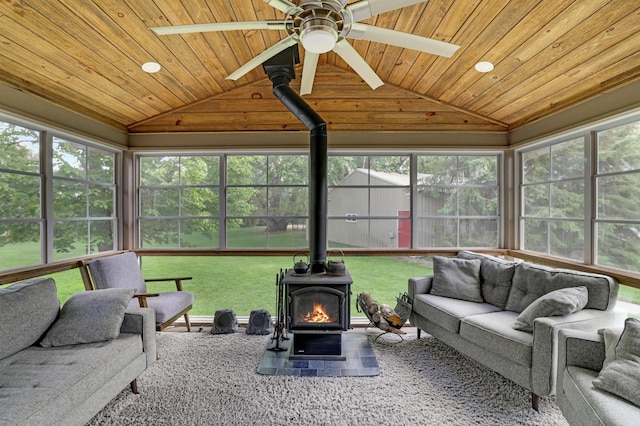 7256 Maciver Ave NE, Otsego, MN 55301 - sunroom / solarium featuring a wood stove, vaulted ceiling, and wooden ceiling