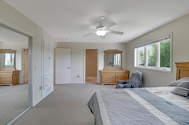 7256 Maciver Ave NE, Otsego, MN 55301 - bedroom featuring light colored carpet, a textured ceiling, and a ceiling fan