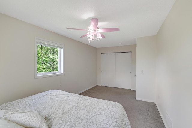 7256 Maciver Ave NE, Otsego, MN 55301 - carpeted bedroom featuring a closet, baseboards, and a ceiling fan