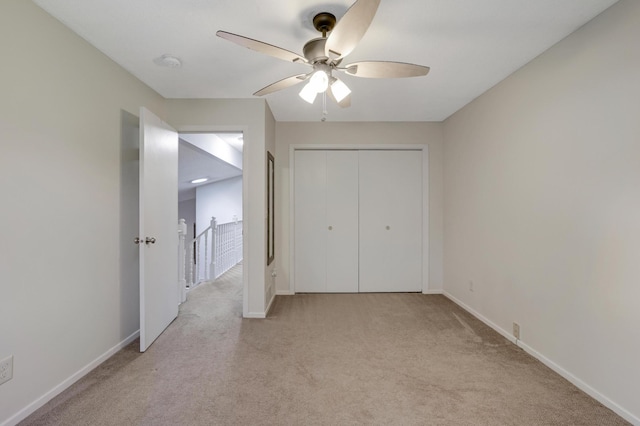 7256 Maciver Ave NE, Otsego, MN 55301 - unfurnished bedroom with light colored carpet, baseboards, a closet, and ceiling fan
