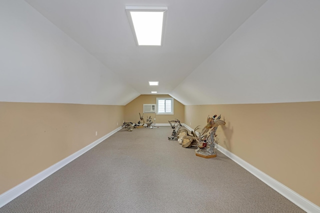 7256 Maciver Ave NE, Otsego, MN 55301 - additional living space with baseboards, lofted ceiling, a wall unit AC, and carpet flooring