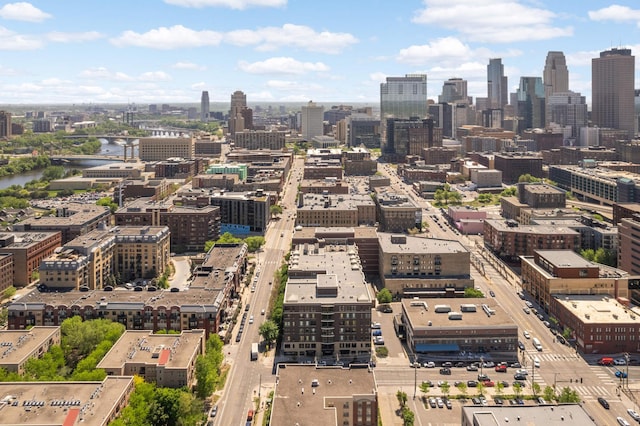 drone / aerial view of a view of skyline and a nearby body of water