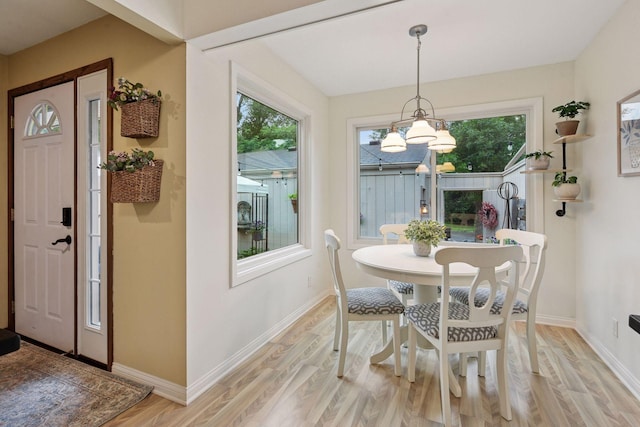 1623 Black Oaks Pl N, Plymouth, MN 55447 - dining space with light wood-style flooring and a chandelier