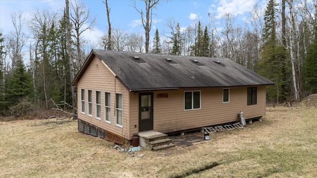 6301 Hunters Pass, Greenwood Twp, MN 55790 - back of property with a shingled roof