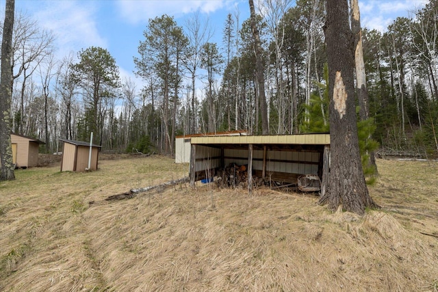 6301 Hunters Pass, Greenwood Twp, MN 55790 - view of pole building featuring a detached carport