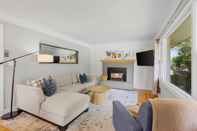 1354 Judith Ave, Roseville, MN 55113 - living area with wood finished floors, a fireplace, and baseboards