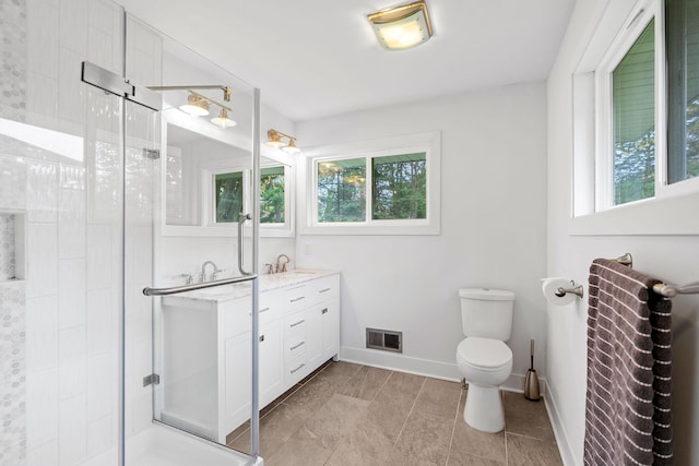 1354 Judith Ave, Roseville, MN 55113 - bathroom featuring plenty of natural light, a stall shower, baseboards, and vanity