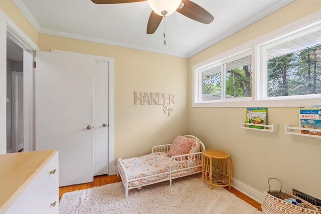 1354 Judith Ave, Roseville, MN 55113 - bedroom featuring crown molding, wood finished floors, and ceiling fan