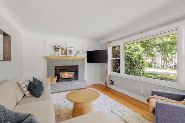 1354 Judith Ave, Roseville, MN 55113 - living room with wood finished floors, a fireplace, and baseboards