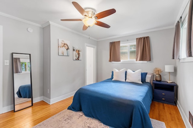 1354 Judith Ave, Roseville, MN 55113 - bedroom featuring light wood finished floors, baseboards, crown molding, and a ceiling fan