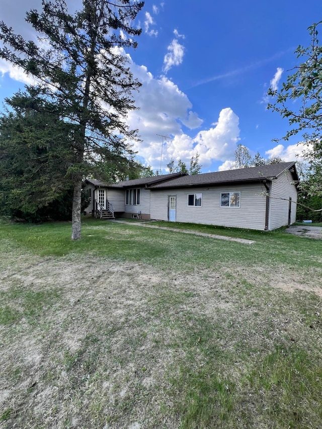 3186 State Highway 11 SE, Baudette, MN 56623 - rear view of property with a lawn