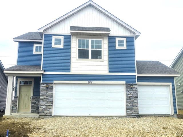 930 Silvercreek Ave W, Delano, MN 55328 - craftsman-style home featuring a shingled roof, stone siding, driveway, and a garage