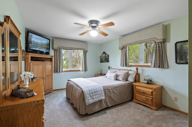 15777 Grover Ave NW, Clearwater Twp, MN 55320 - bedroom with light carpet, baseboards, a ceiling fan, and a textured ceiling