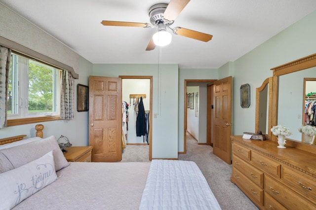 15777 Grover Ave NW, Clearwater Twp, MN 55320 - bedroom featuring a walk in closet, a closet, and light colored carpet
