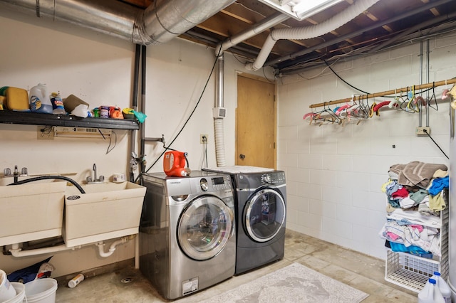 15777 Grover Ave NW, Clearwater Twp, MN 55320 - clothes washing area featuring independent washer and dryer and concrete block wall