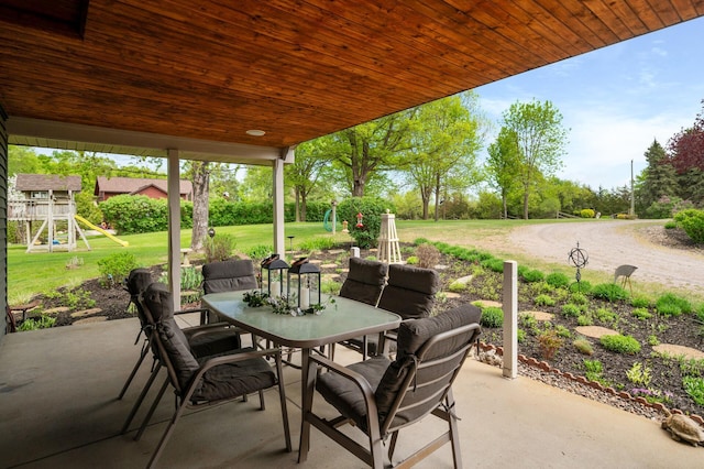 15777 Grover Ave NW, Clearwater Twp, MN 55320 - view of patio / terrace featuring outdoor dining space and a playground