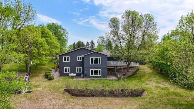 15777 Grover Ave NW, Clearwater Twp, MN 55320 - back of house with a patio area, a wooden deck, a yard, and a chimney