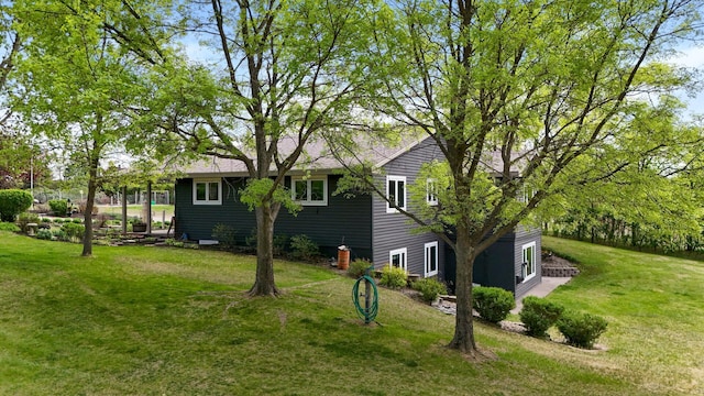 15777 Grover Ave NW, Clearwater Twp, MN 55320 - back of house featuring a yard