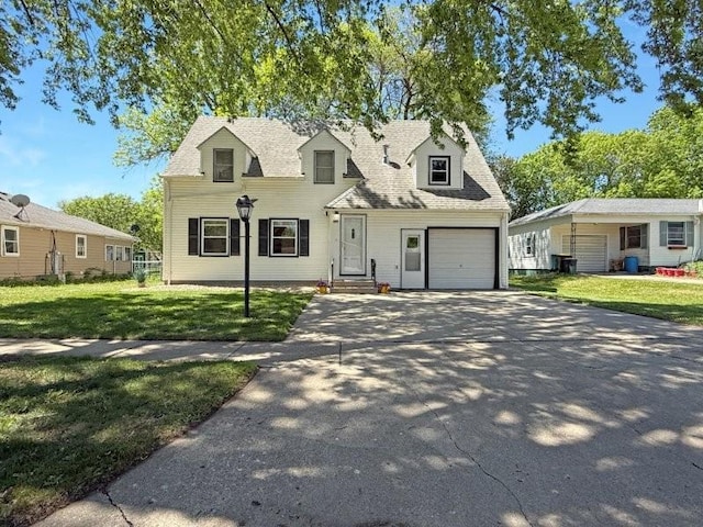 213 1st Ave E, Truman, MN 56088 - cape cod-style house with a front yard, an attached garage, and concrete driveway