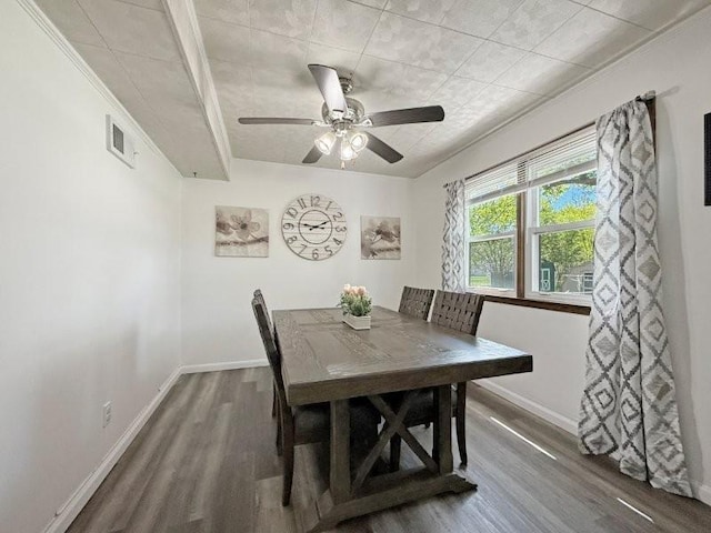 213 1st Ave E, Truman, MN 56088 - dining area featuring wood finished floors, baseboards, and ceiling fan