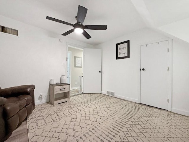 213 1st Ave E, Truman, MN 56088 - living area with a ceiling fan and baseboards