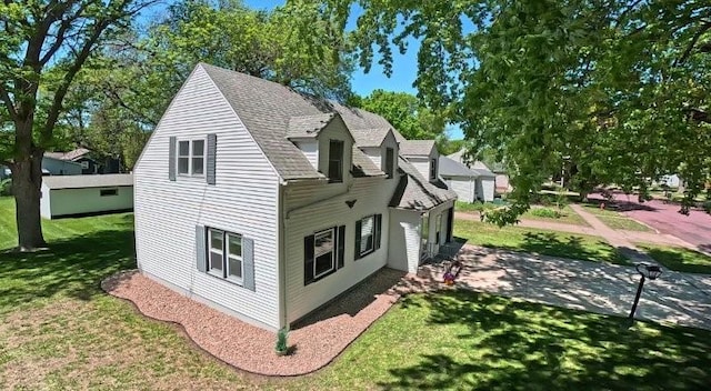 213 1st Ave E, Truman, MN 56088 - view of side of property with a lawn and roof with shingles