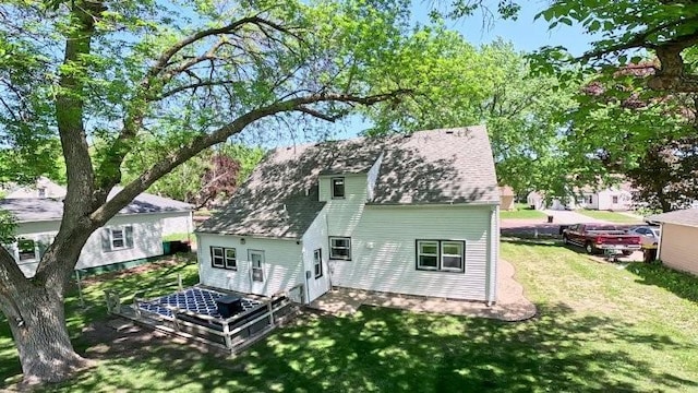 213 1st Ave E, Truman, MN 56088 - back of house featuring a yard