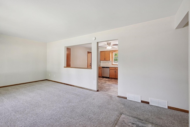 unfurnished living room with light colored carpet, baseboards, and a ceiling fan