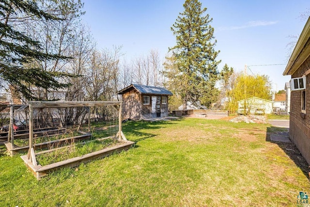 1815 Carlton Ave, Cloquet, MN 55720 - view of yard featuring a garden and an outdoor structure