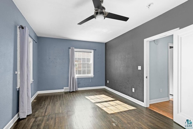 1815 Carlton Ave, Cloquet, MN 55720 - unfurnished bedroom with wood finished floors, baseboards, and a ceiling fan