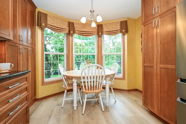 2917 85th St E, Inver Grove Heights, MN 55076 - dining space featuring light wood-style flooring, plenty of natural light, and baseboards
