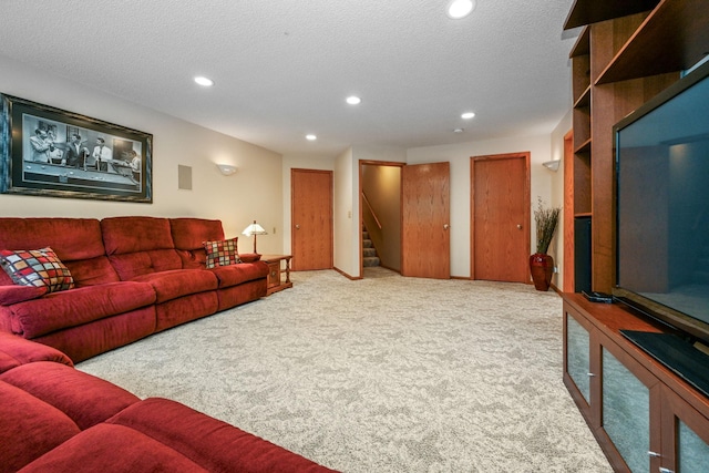 2917 85th St E, Inver Grove Heights, MN 55076 - carpeted living room with recessed lighting, stairs, and a textured ceiling