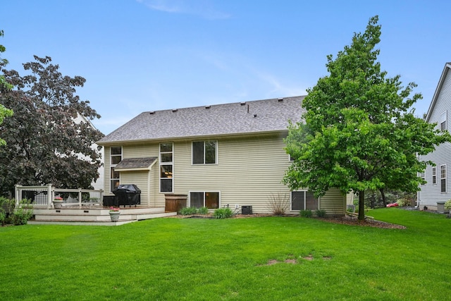 2917 85th St E, Inver Grove Heights, MN 55076 - rear view of house featuring a deck, a lawn, roof with shingles, and central air condition unit