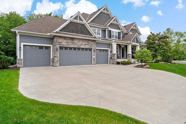 5315 Ranchview Ln N, Plymouth, MN 55446 - craftsman-style home featuring concrete driveway, a front lawn, stone siding, a porch, and an attached garage