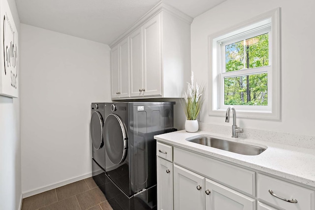 5315 Ranchview Ln N, Plymouth, MN 55446 - laundry room with cabinet space, washing machine and clothes dryer, and baseboards