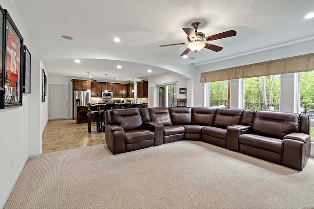 5315 Ranchview Ln N, Plymouth, MN 55446 - living room with light colored carpet, recessed lighting, healthy amount of natural light, a ceiling fan, and arched walkways