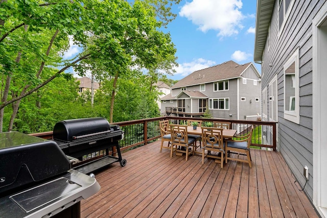 5315 Ranchview Ln N, Plymouth, MN 55446 - wooden deck featuring outdoor dining space, grilling area, and a residential view