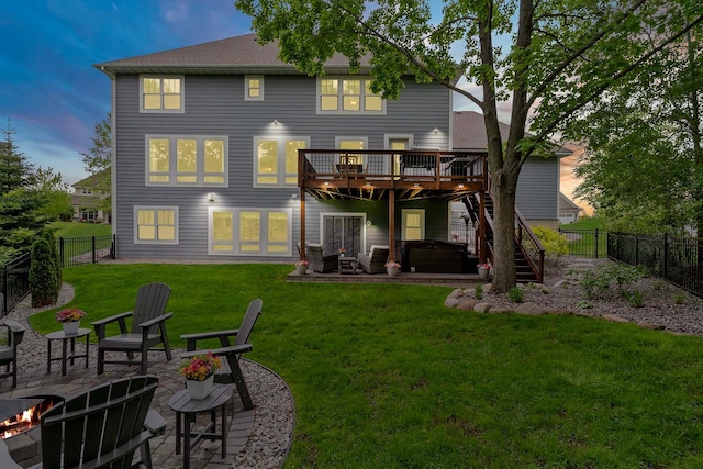 5315 Ranchview Ln N, Plymouth, MN 55446 - back of house at dusk featuring a hot tub, an outdoor fire pit, a wooden deck, and a patio area