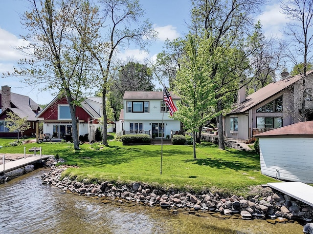 1379 7th Ave SE, Forest Lake, MN 55025 - back of house with a water view and a lawn