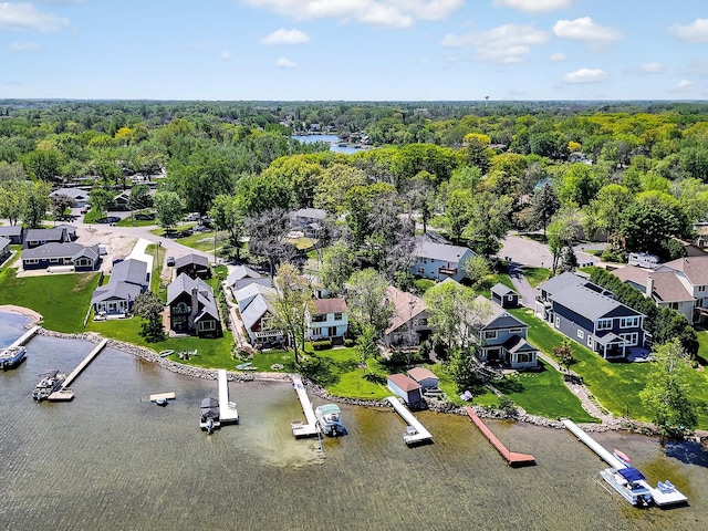 1379 7th Ave SE, Forest Lake, MN 55025 - aerial view of residential area featuring a nearby body of water and a heavily wooded area